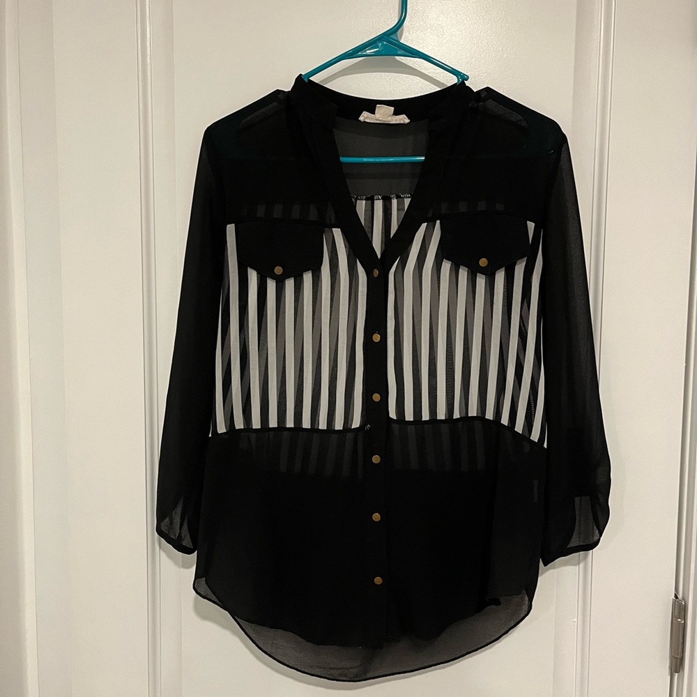 Black and white striped button down with gold buttons.